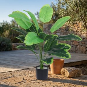 צמח עלים טרופיים מלאכותי בעציץ שחור